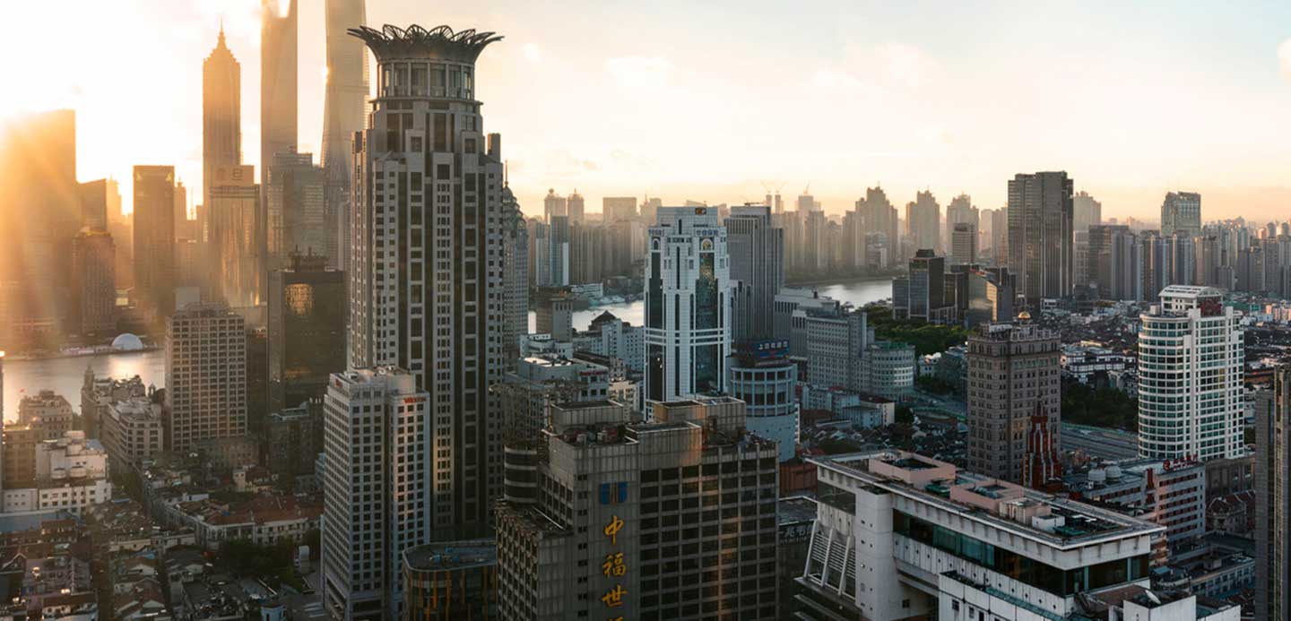 A top view of solar panels spread across mountain tops, illustrating the future of sustainability.